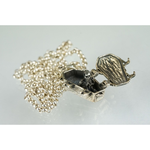 216A - A small collection of contemporary silver jewellery to include a coffin necklace, skull ring and Spi... 