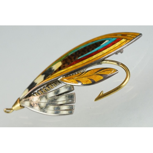 223 - A fully hallmarked sterling silver and enamel brooch in the form of a fishing fly.