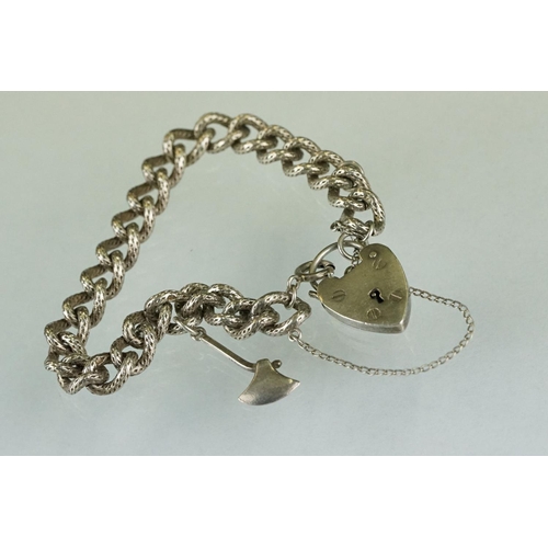 224 - A silver charm bracelet together with a silver gilt bangle.