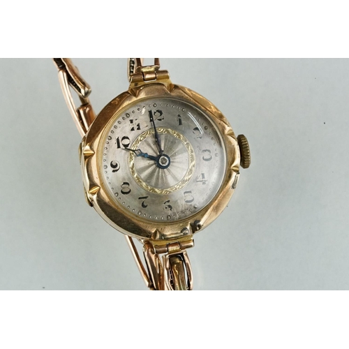 225 - Early 20th century 9ct gold cased ladies wristwatch with yellow metal strap and silvered dial.