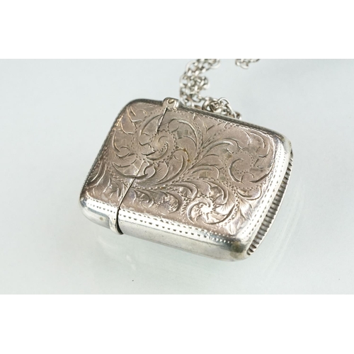 228A - A fully hallmarked sterling silver vesta case together with a sterling silver baby rattle in the for... 