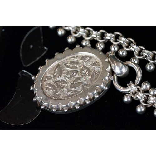 230 - A fully hallmarked sterling silver locket pendant on ornate silver chain.