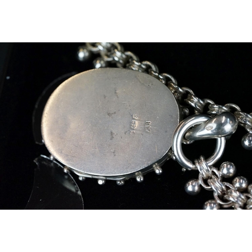 230 - A fully hallmarked sterling silver locket pendant on ornate silver chain.