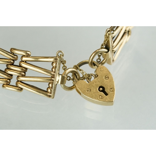 232 - A fully hallmarked ladies 9ct gold gate bracelet with padlock safety chain.