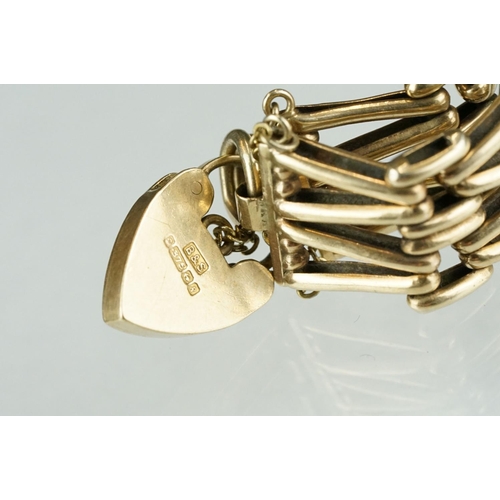 232 - A fully hallmarked ladies 9ct gold gate bracelet with padlock safety chain.