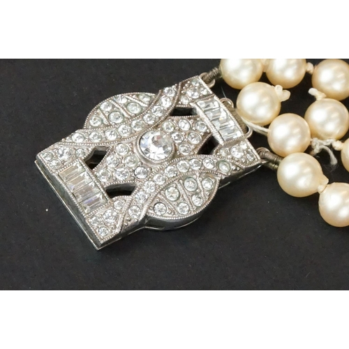 234 - A ladies pearl necklace with sterling silver Art Deco clasp together with a hallmarked gold ring.