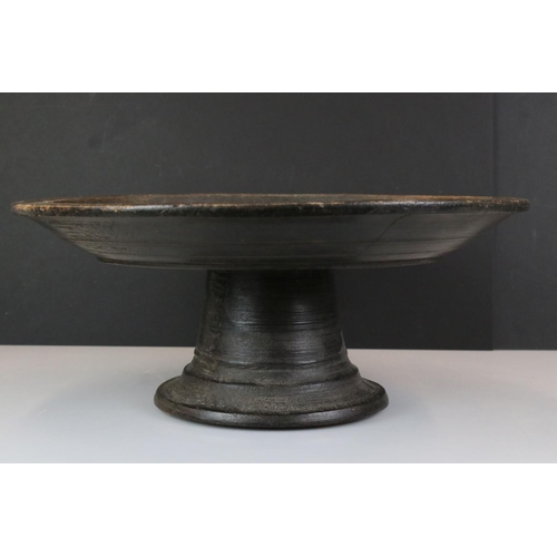 193 - Antique large oak circular cake stand with a plain carved top raised on a turned foot, approx 48cm a... 