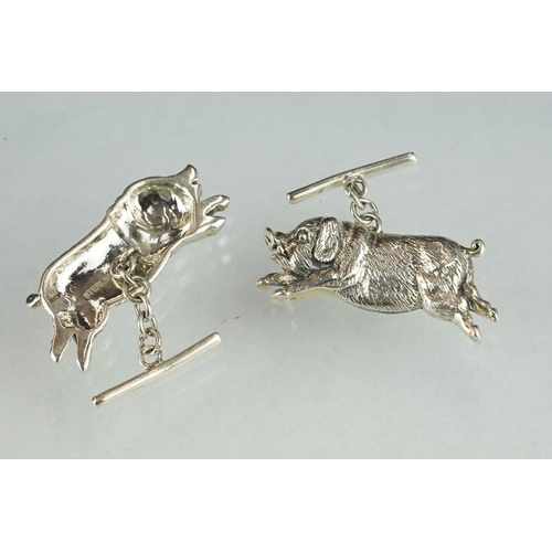 243 - Pair of silver pig cufflinks