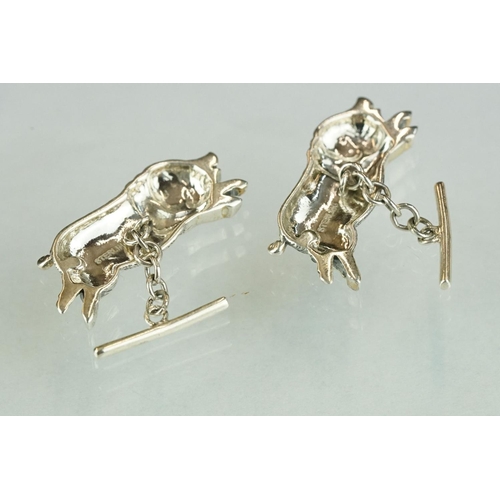 243 - Pair of silver pig cufflinks