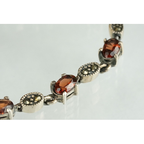 247 - Silver marcasite and garnet line bracelet