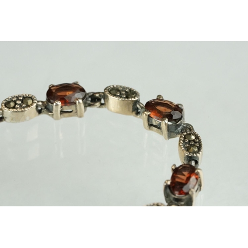 247 - Silver marcasite and garnet line bracelet