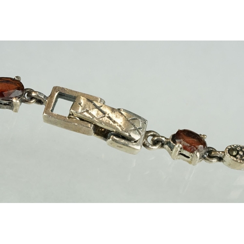 247 - Silver marcasite and garnet line bracelet