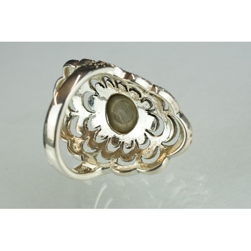 248 - Large silver ring with marcasite and opal set central panel