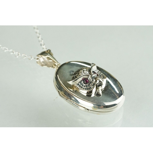 254 - Silver photo locket pendant with embossed owl figure