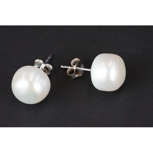 259 - Pair of large pearl stud earrings on silver posts