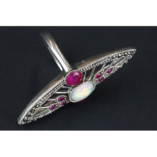 268 - Silver dress ring with central opal panel and rubellite stones