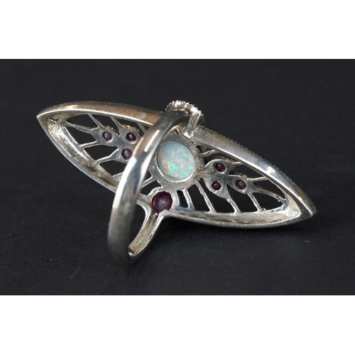 268 - Silver dress ring with central opal panel and rubellite stones