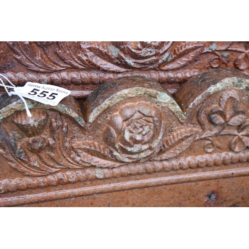 555 - Twenty one Victorian Garden Edging Stones with moulded flower decoration, each 24cm long