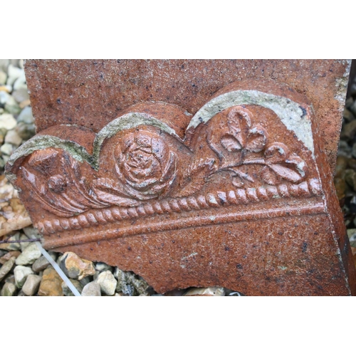 555 - Twenty one Victorian Garden Edging Stones with moulded flower decoration, each 24cm long