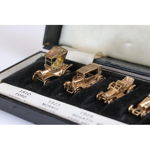 135 - A cased set of six fully hallmarked 9ct gold model cars by E&H of Birmingham to include Ford, Morris... 