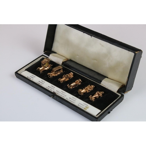 135 - A cased set of six fully hallmarked 9ct gold model cars by E&H of Birmingham to include Ford, Morris... 