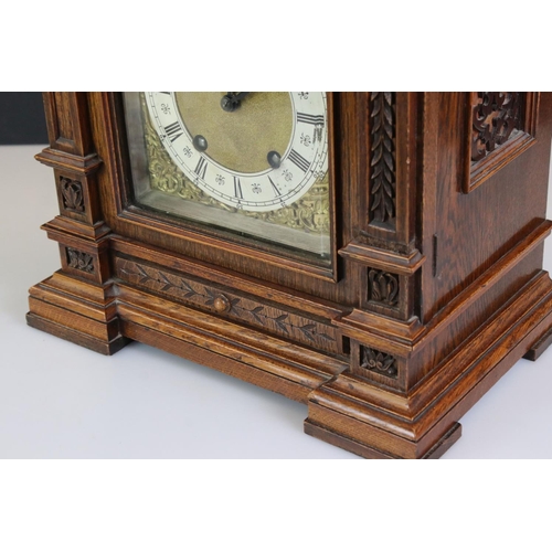 157 - Late 19th / Early 20th Century Lenzkirch carved oak bracket clock, the brass dial with silvered chap... 