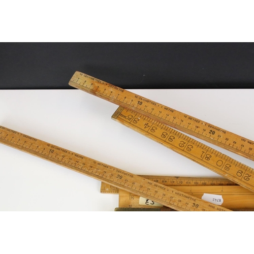 390 - Approximately Twenty Five Early to Mid century Wooden Rulers, some folding including Rabone, Helix p... 