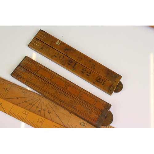 390 - Approximately Twenty Five Early to Mid century Wooden Rulers, some folding including Rabone, Helix p... 