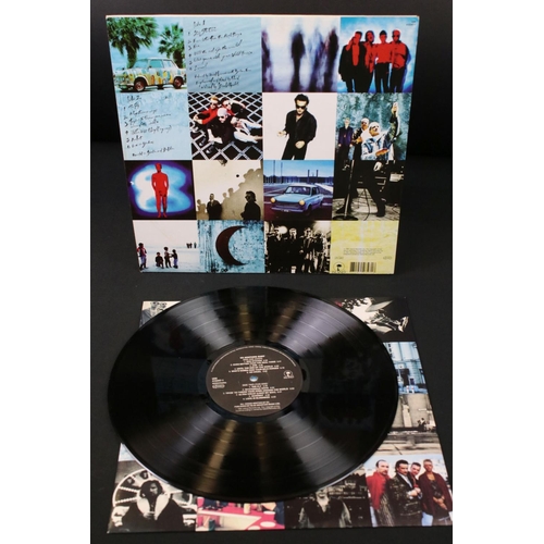 64 - Vinyl - U2 Achtung Baby on Island Records U28 / 510347-1.  Sleeve & Vinyl Ex