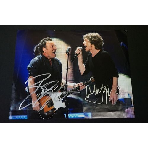 776 - Memorabilia & Autograph - A photograph of Bruce Springsteen and Mick Jagger on stage, signed in silv... 