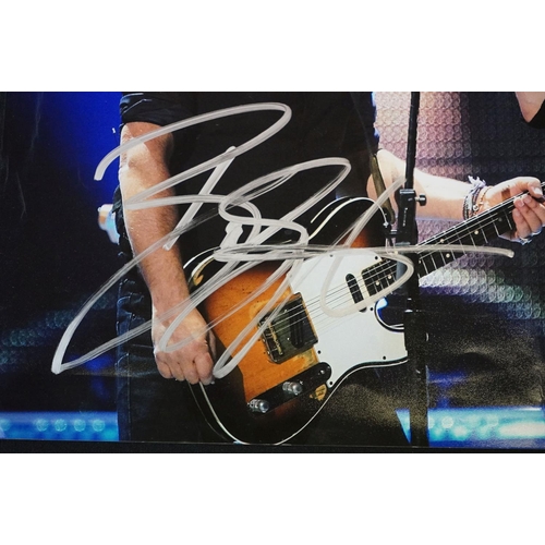 776 - Memorabilia & Autograph - A photograph of Bruce Springsteen and Mick Jagger on stage, signed in silv... 