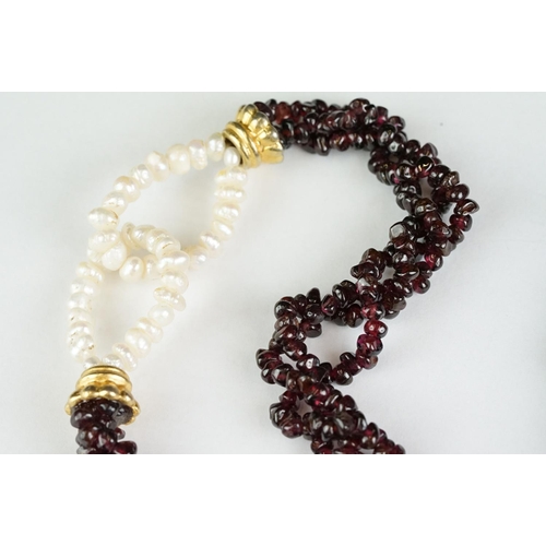 189 - A garnet and natural pearl necklace together with a white metal marcasite brooch in the form of scal... 