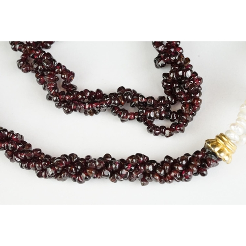 189 - A garnet and natural pearl necklace together with a white metal marcasite brooch in the form of scal... 