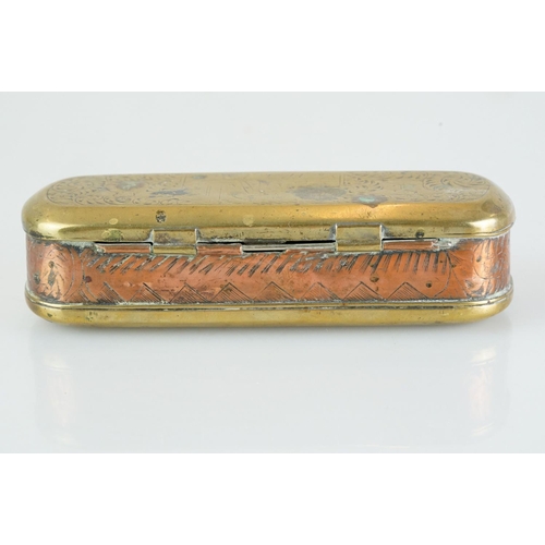 375 - An antique 18th century brass and copper snuff box with ornate chased decoration.