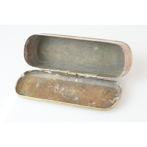 375 - An antique 18th century brass and copper snuff box with ornate chased decoration.