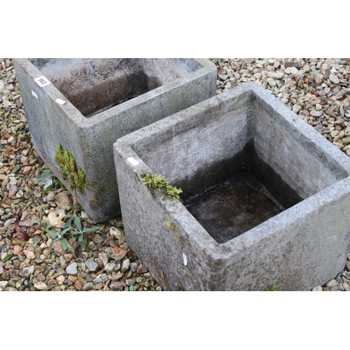 563 - A pair of reconstituted stone square planters, 30cm high