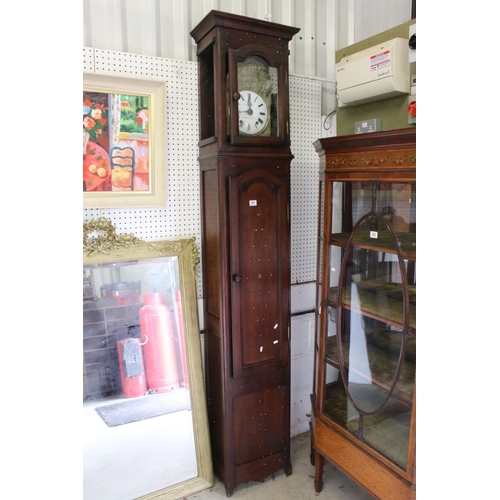 567 - 19th century French Oak Longcase Clock, eight day, the brass repousse arched face with a white dial ... 