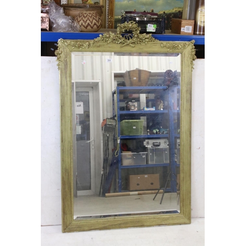 568 - Large Gilt Framed Rectangular Bevelled Edge Mirror decorated with floral swags, 102cm x 149cm high