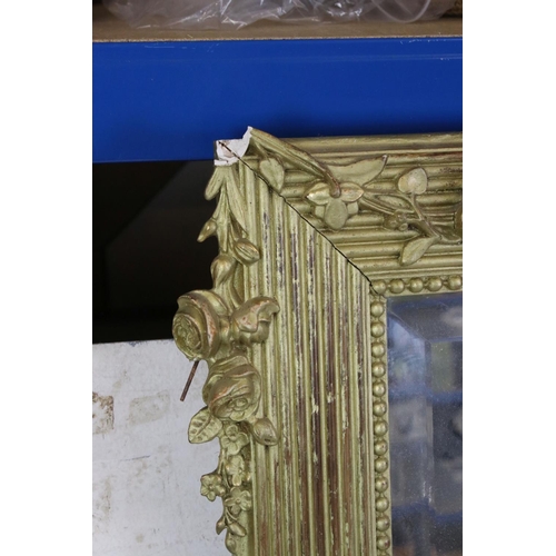 568 - Large Gilt Framed Rectangular Bevelled Edge Mirror decorated with floral swags, 102cm x 149cm high