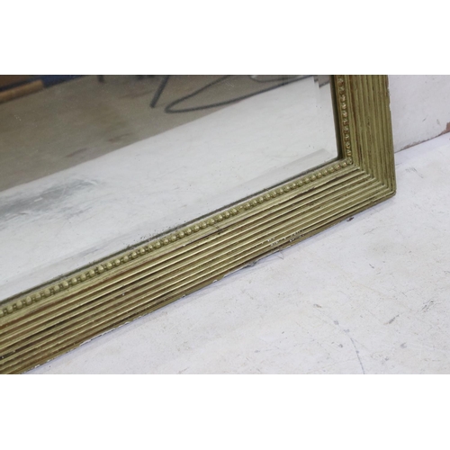 568 - Large Gilt Framed Rectangular Bevelled Edge Mirror decorated with floral swags, 102cm x 149cm high