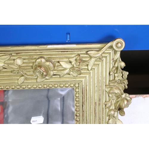 568 - Large Gilt Framed Rectangular Bevelled Edge Mirror decorated with floral swags, 102cm x 149cm high