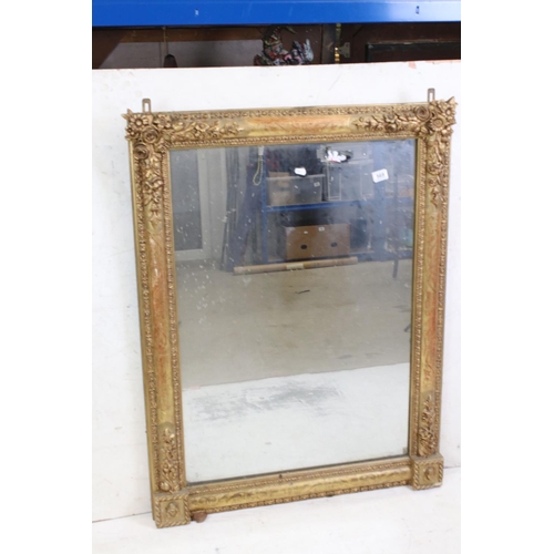 569 - Gilt Framed Rectangular Overmantle Mirror with moulded floral detail, 88cm x 113cm