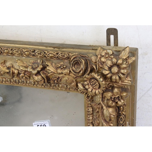 569 - Gilt Framed Rectangular Overmantle Mirror with moulded floral detail, 88cm x 113cm