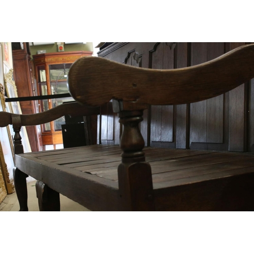 574 - 18th / 19th century Oak Hall Bench with five panel to back, open arms, solid seat, raised on three s... 