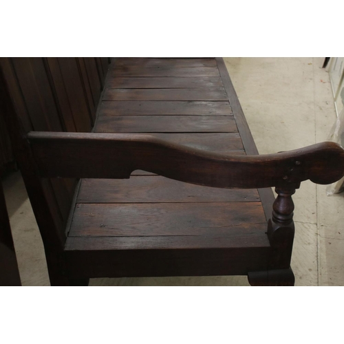 574 - 18th / 19th century Oak Hall Bench with five panel to back, open arms, solid seat, raised on three s... 