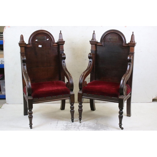 577 - Pair of Early 20th century Oak Throne type Chairs, with solid back, open scrolling arms and upholste... 