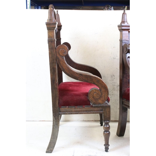 577 - Pair of Early 20th century Oak Throne type Chairs, with solid back, open scrolling arms and upholste... 