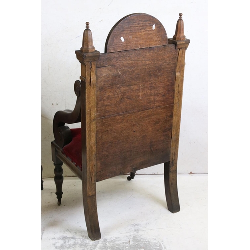 577 - Pair of Early 20th century Oak Throne type Chairs, with solid back, open scrolling arms and upholste... 