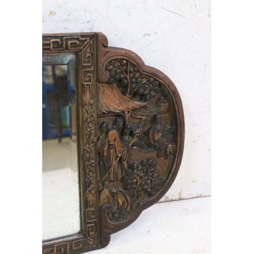 580 - 1920's / 30's Wooden Wall Mirror, carved in the chinese manner with relief scenes of figures to eith... 