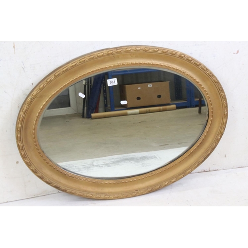 581 - Gilt Framed Oval Wall Mirror with bevelled edge, 89cm long